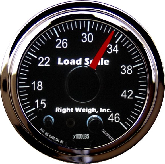 Right Weigh analog load scale gauge mounted in truck cab showing axle weight in pounds