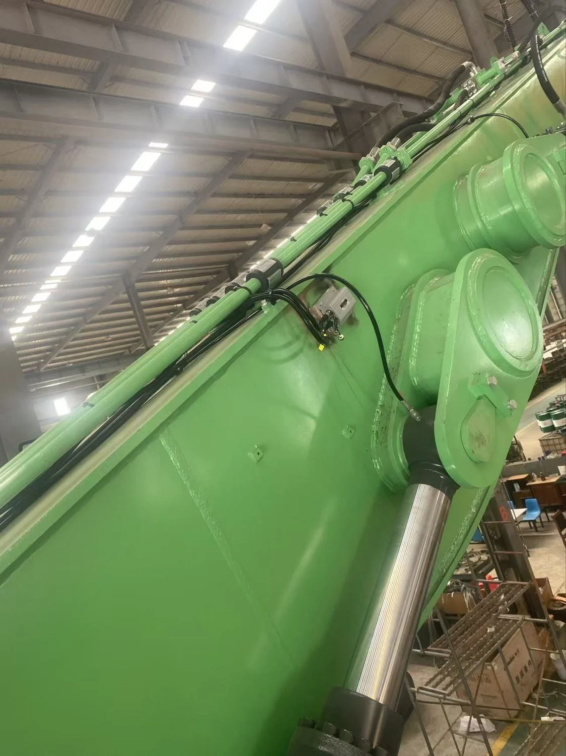 Boom angle sensor mounted on the boom side with corrugated conduit cable protection